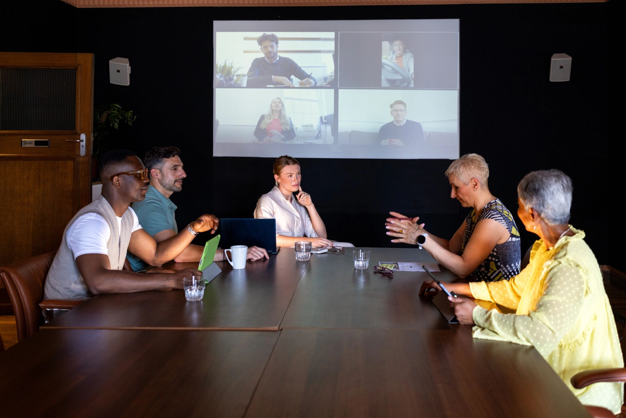 Hybrid team collaborating in a video conference meeting