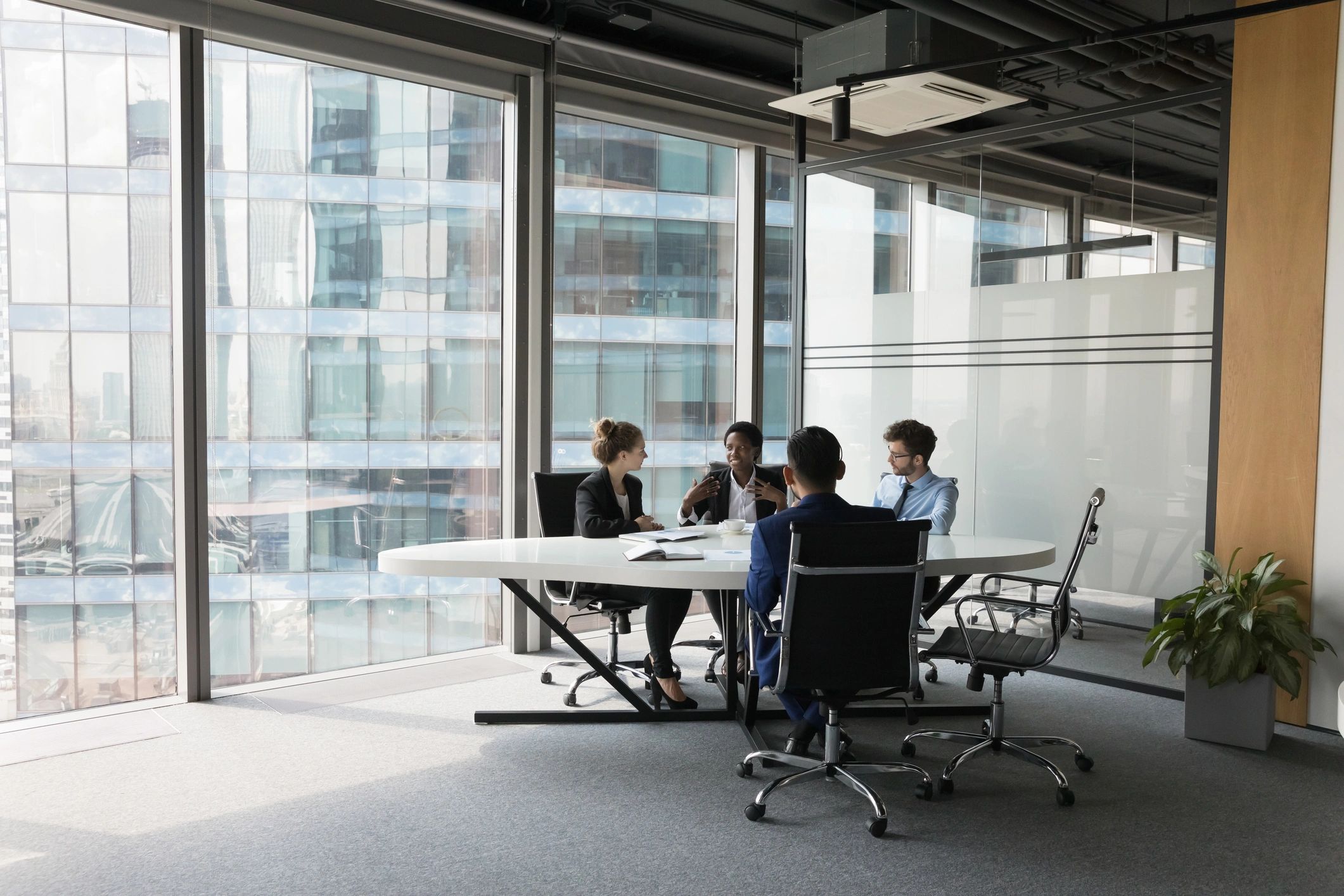 Business technology consulting team meeting in a modern office