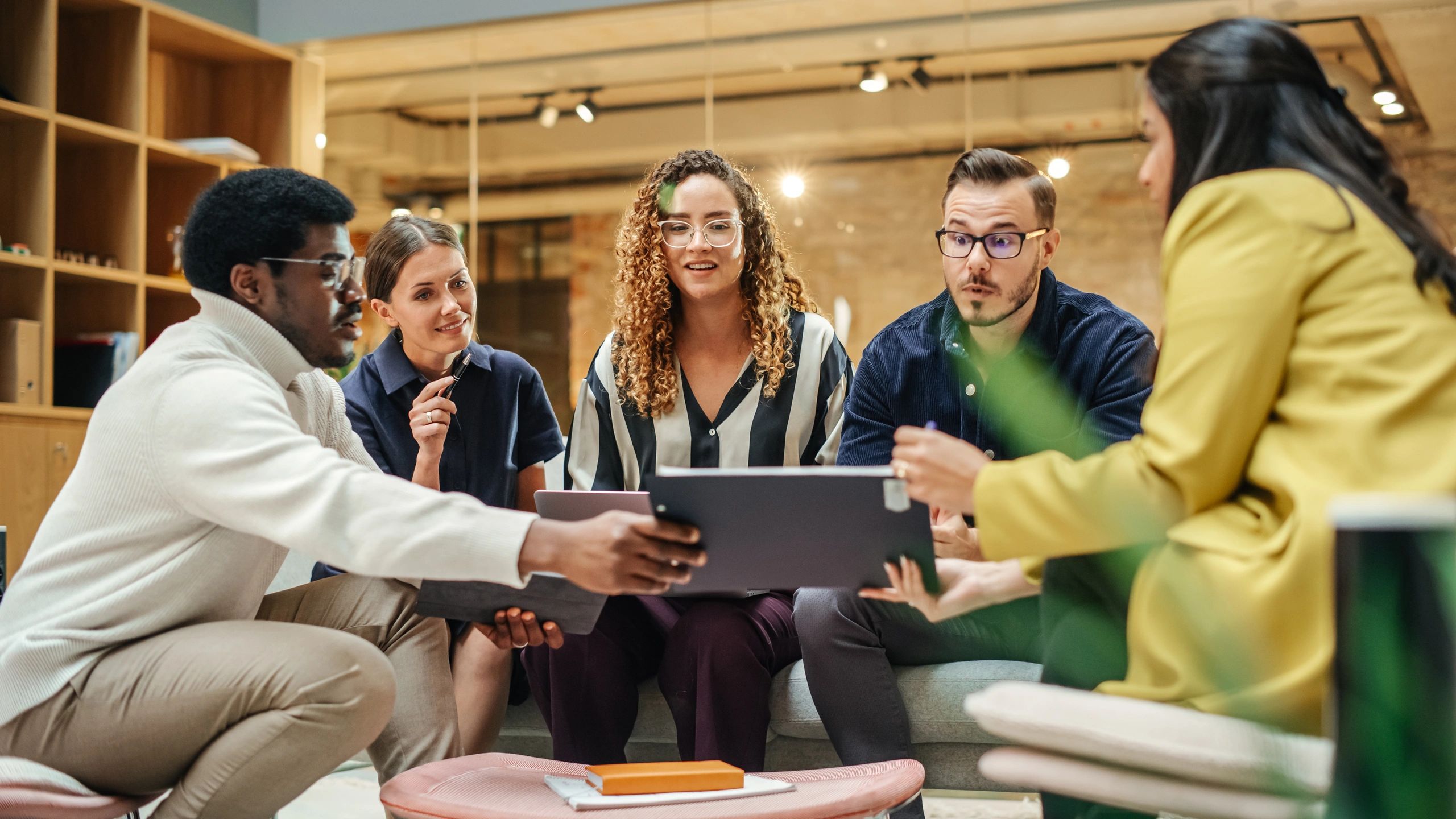 Consulting team reviewing technology strategy in a modern office