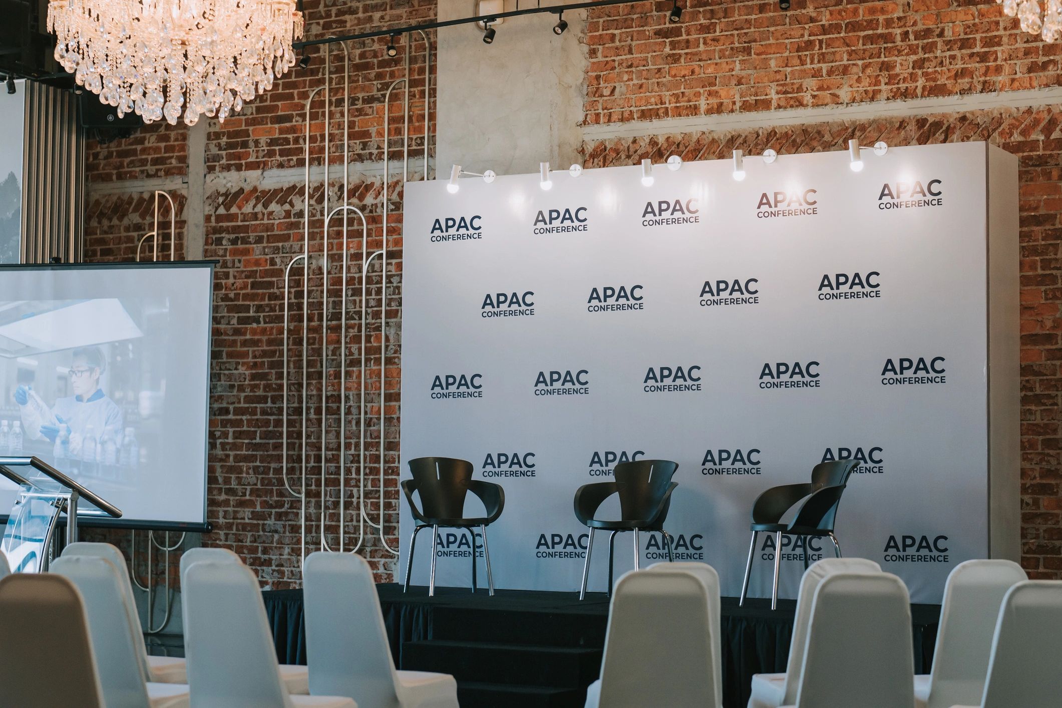 Conference presentation space with large screen and seating